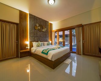 ثري براذرز بنجالوز آند فيلاز - كوتا - غرفة نوم