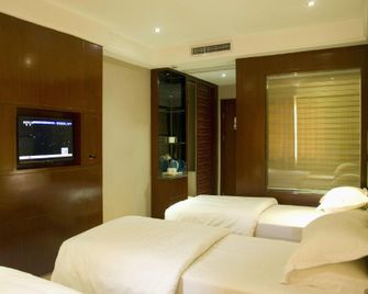 Wanjia Hotel - Huanggang - Bedroom