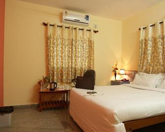 Ample Inn - Devanhalli - Bedroom