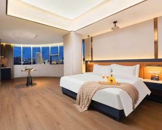 Nanchang Zhongsen Yilin International Hotel (Bayi Square Branch) - Nanchang - Schlafzimmer