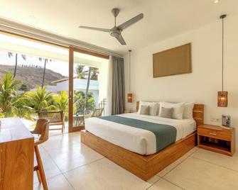 Sikara Lombok Hotel - Kuta - Schlafzimmer