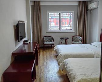 Dijin Holiday Hotel - טיאנג'ין - חדר שינה