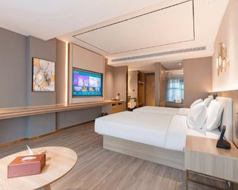 Orange Hotel Taizhou Jiangyan District Government - Tchaj-čou - Ložnice