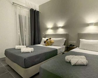 ديليون هوتل - باريكيا - غرفة نوم