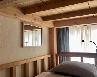 Golden Mile Hostel - Amami - Bedroom