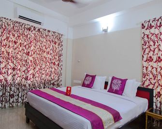 OYO 5805 Uthradam Towers - Thiruvananthapuram - Habitación