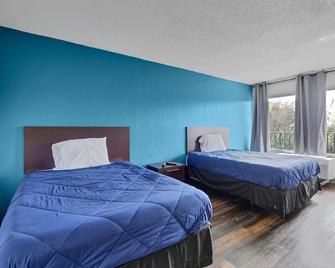 Zen Living Suites Extended Stay - Jacksonville - Orange Park - Orange Park - Schlafzimmer