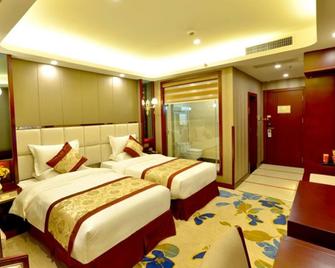 Greentree Eastern Zigong Huashang International City Huichuan Road Hotel - Zigong - Bedroom