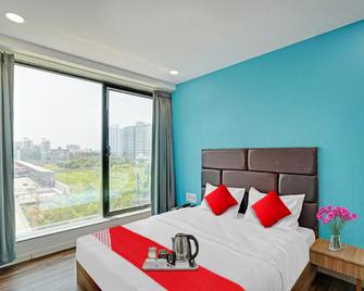 Hotel O Infinity - Surat - Schlafzimmer