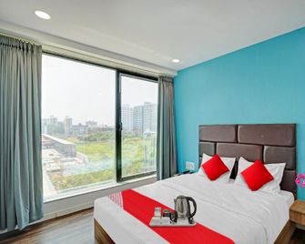 Hotel O Infinity - Surat - Bedroom