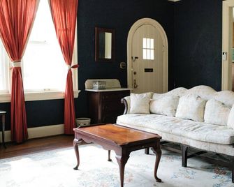 Skip the hotel-room shuffle. Give the family room to spread out, the dog a yard to explore, and everyone a place to come back together. - Montgomery - Living room