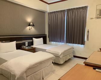 Kai Xin Hotel - Xincheng Township - Schlafzimmer