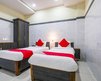 Super Hotel O Src Grand - Vijayawada - Bedroom