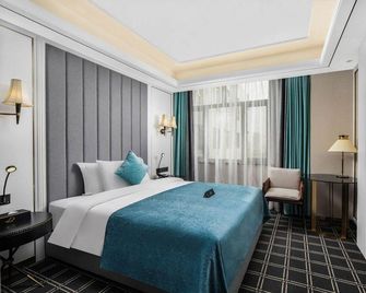 Xana Deluxe Yinchuan Jinfeng Hotel - Yinchuan - Bedroom