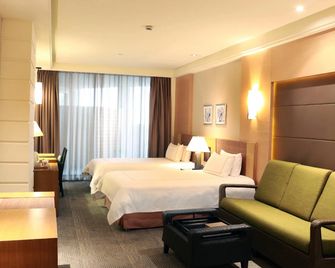 Huana Hotel Minhang Shanghai - שנחאי - חדר שינה