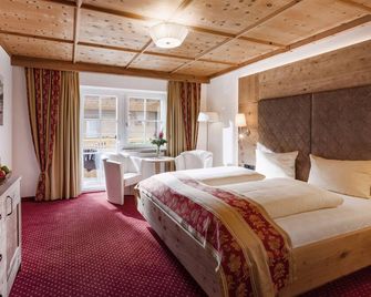 Hotel Alpenherz - גרלוס - חדר שינה