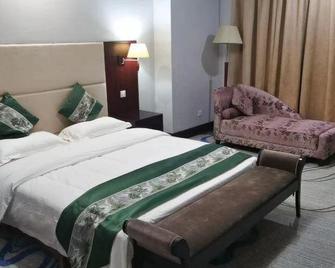 Dongming International Hotel - Heze - Schlafzimmer