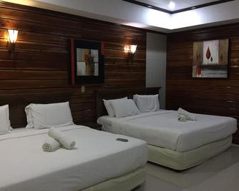 Dumaluan Beach Resort - פנגלאו - חדר שינה