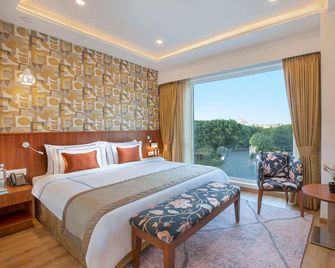 ExpoInn Suites and Convention - Greater Noida - Schlafzimmer