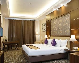 Adhiwangsa Hotel & Convention Hall - סורקטה - חדר שינה