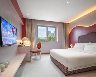 Nanyang Art Exquisite Hotel (Nanyang Fuyu Wuhouyu Branch) - نانيانغ - غرفة نوم