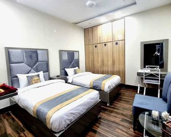 Hotel Grand Pakeeza - Láhaur - Ložnice