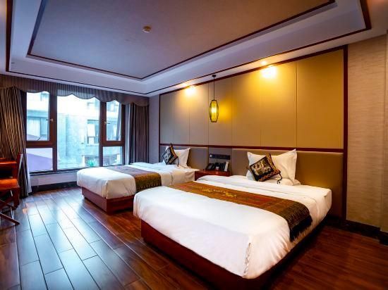 Yunshangpin International Hotel - Xishuangbanna - Quarto