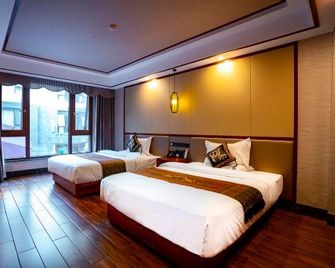 Yunshangpin International Hotel - Xishuangbanna - Quarto
