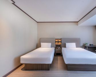 Hanting Hotel Xishuangbanna Kongquehu - Xishuangbanna - Habitación