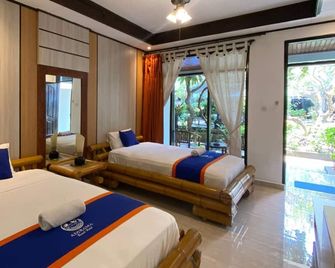 New Adirama Beach Hotel - Banjar - Bedroom