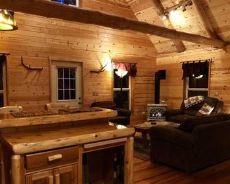 Cozy, secluded, year-round Cabin Rental with a Hot Tub! - Munising - Living room