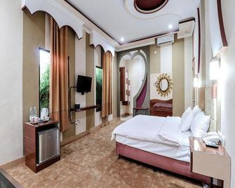Sartini Inn Jogja - Depok - Habitación