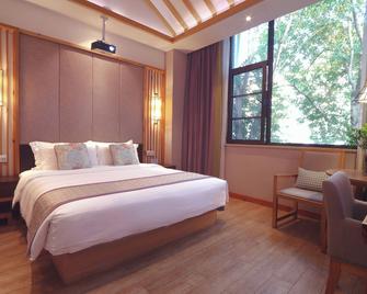 Mild Spring Boutique Hotel - Huangshan - Schlafzimmer