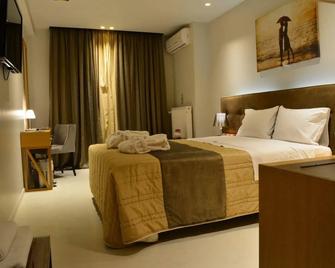 Trokadero Boutique Hotel - Itéa - Ložnice