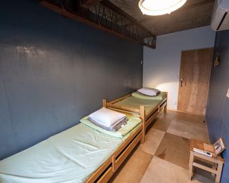 Kamp Houkan-cho Backpacker's Inn & Lounge - Okayama - Slaapkamer