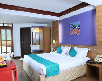 Westwood Riverside Garden Resort - Munnar - Kamar Tidur