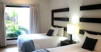 Hotel Contempo - Managua - Schlafzimmer