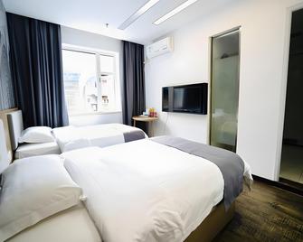 Thank Inn Hotel Sichuan Suining Suizhou Nan Road - Suining - Slaapkamer