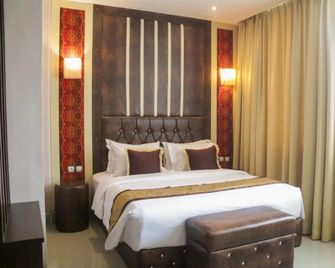 Aurila Hotel - Palangkaraya - Slaapkamer