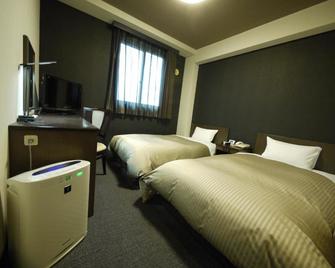 Hotel Route-Inn Court Kofu Isawa - Fuefuki - Bedroom