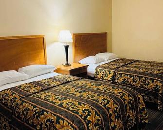 Executive Inn & Suites - Richmond - Schlafzimmer
