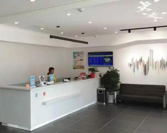 Kelinning Hotel Dongying Taihangshan Road - Dongying - Front desk