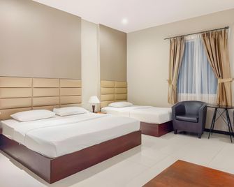 Nagoya One Hotel - Batam - Camera da letto