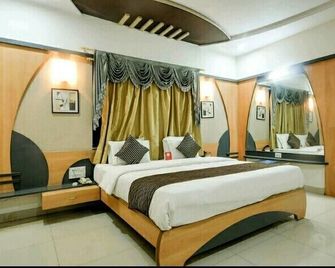 The Malay comfort- Hotel Dwarka residency - Dwārka - Bedroom