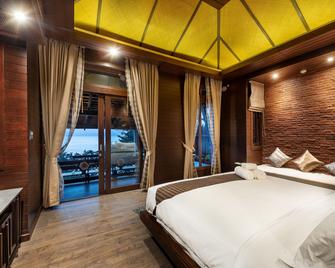 Nirvana Beach Resort - Ko Lanta - Soveværelse