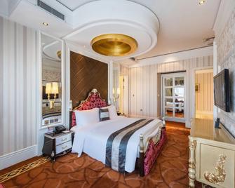 Huafu Wanguo Hotel - Chaoyang - Bedroom