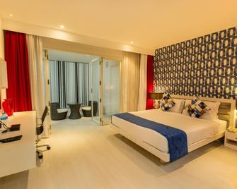 M Inn - Coimbatore - Slaapkamer