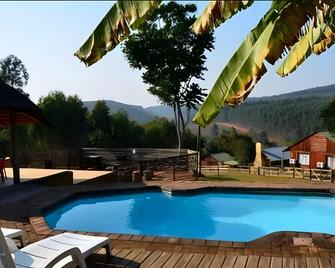 Tsanana Log Cabins and Mullberry Lane Suites - Graskop - Schlafzimmer