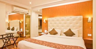 Hotel New Leaf - Poona - Slaapkamer
