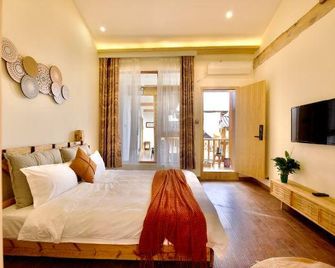 Hualou Zhilian Hostel - ליז'יאנג - חדר שינה